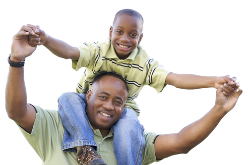 boy on father's shoulders